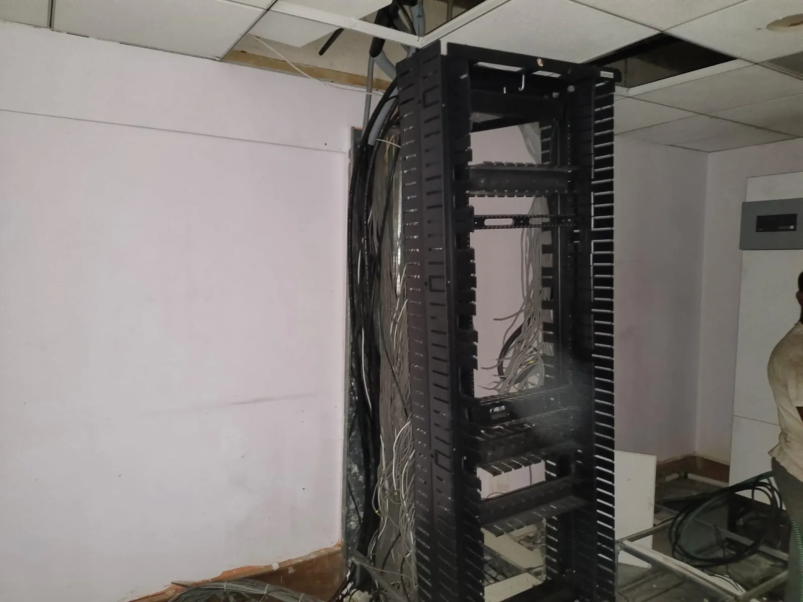 Staged Commercial Cargo Loads | Office Shifting Services Koramangala Stacked metal framing and server equipment staged securely during office shifting services Koramangala.